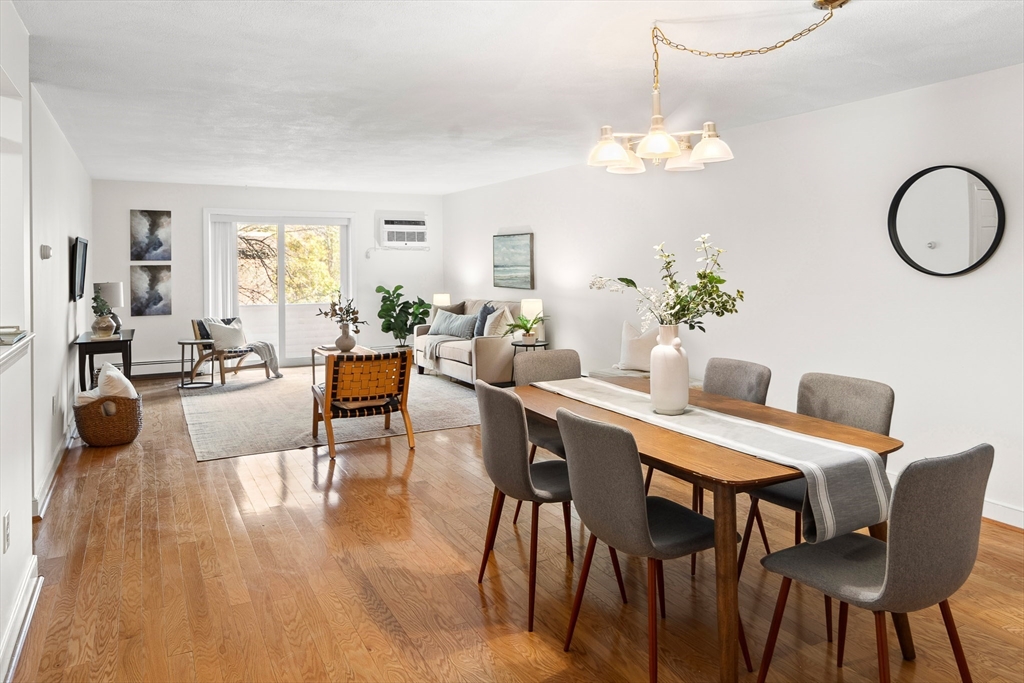 111 Pleasant Street, Unit 24 Watertown, MA 02472 - Photo 2 of 20 a view of a dining room with furniture window and wooden floor
