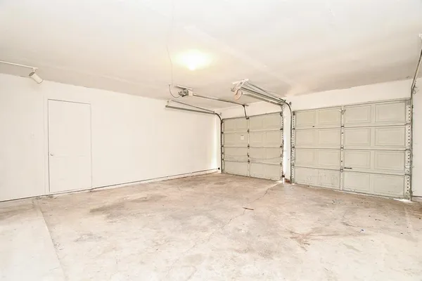 an empty room with white walls