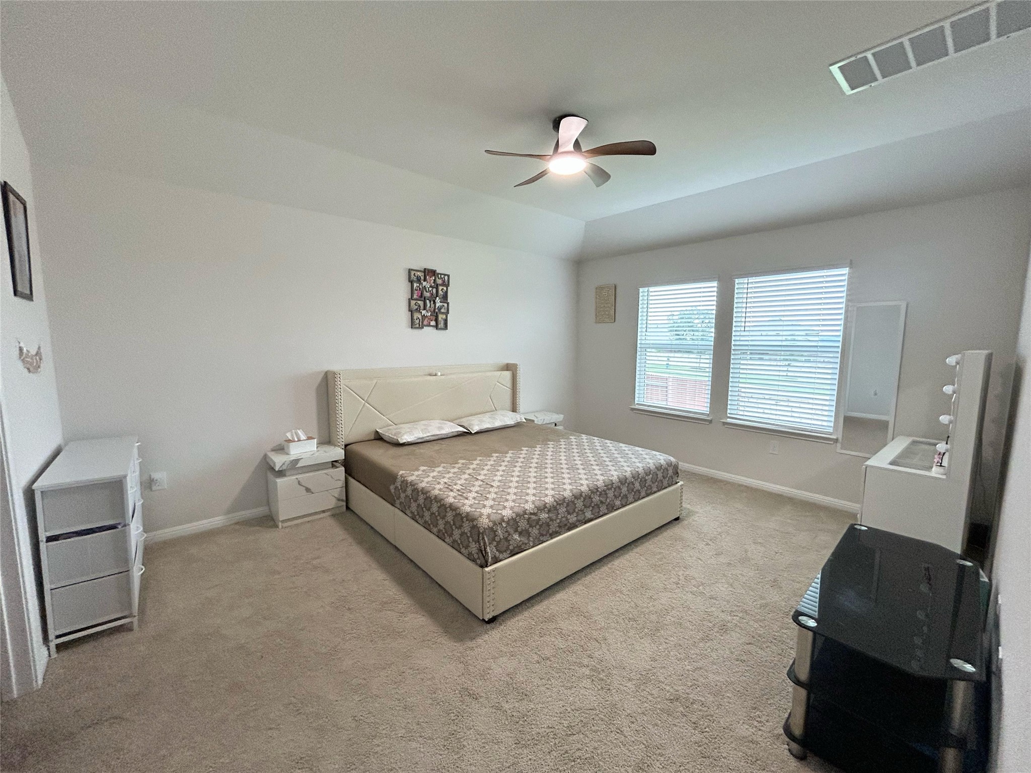 2412 Lightning View Leander, TX 78641 - Photo 10 of 24 A quiet retreat, this bedroom offers plush carpeting and a cooling ceiling fan.