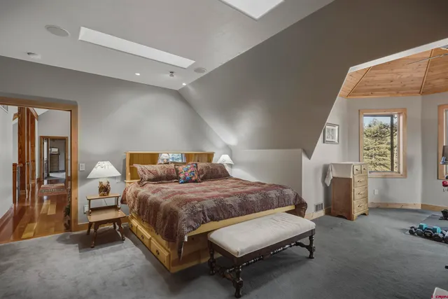 a bedroom with a bed and a walk in closet