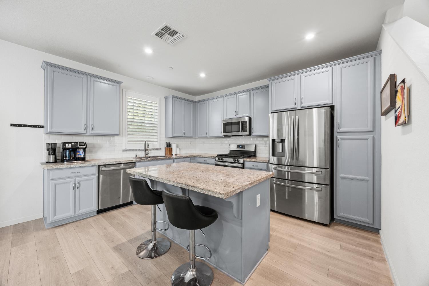 1048 Knox Way Roseville, CA 95747 - Photo 11 of 29 a kitchen with stainless steel appliances granite countertop a refrigerator sink and stove