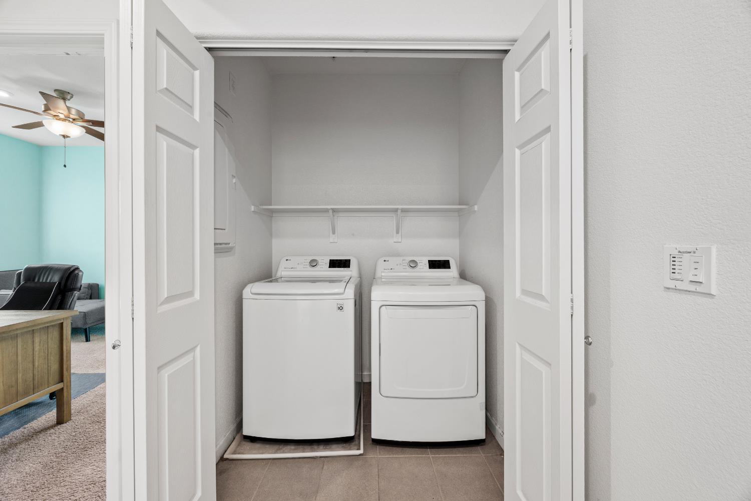 1048 Knox Way Roseville, CA 95747 - Photo 17 of 29 a view of storage and utility room with washer and dryer