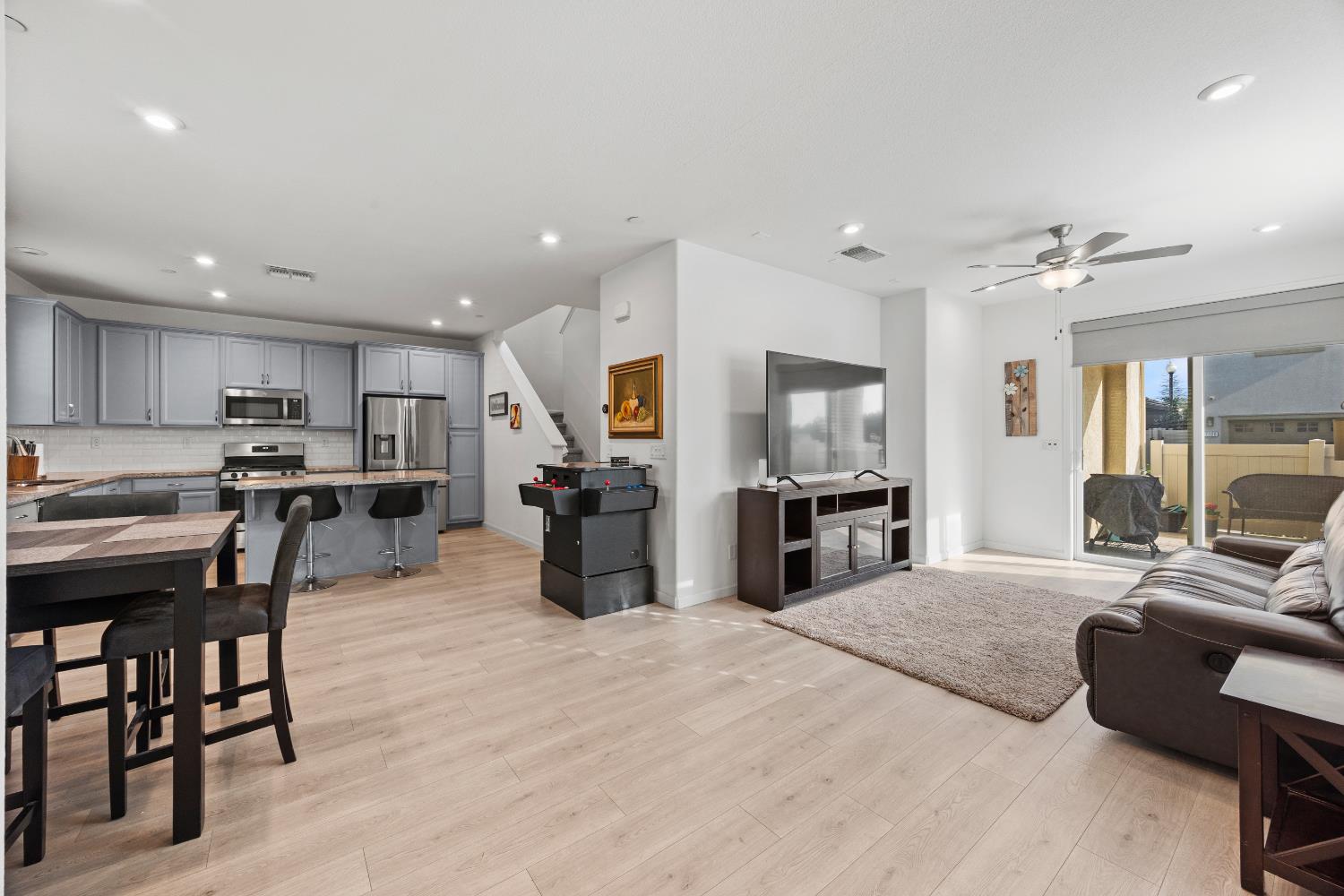 1048 Knox Way Roseville, CA 95747 - Photo 5 of 29 a kitchen with stainless steel appliances kitchen island granite countertop a refrigerator and cabinets