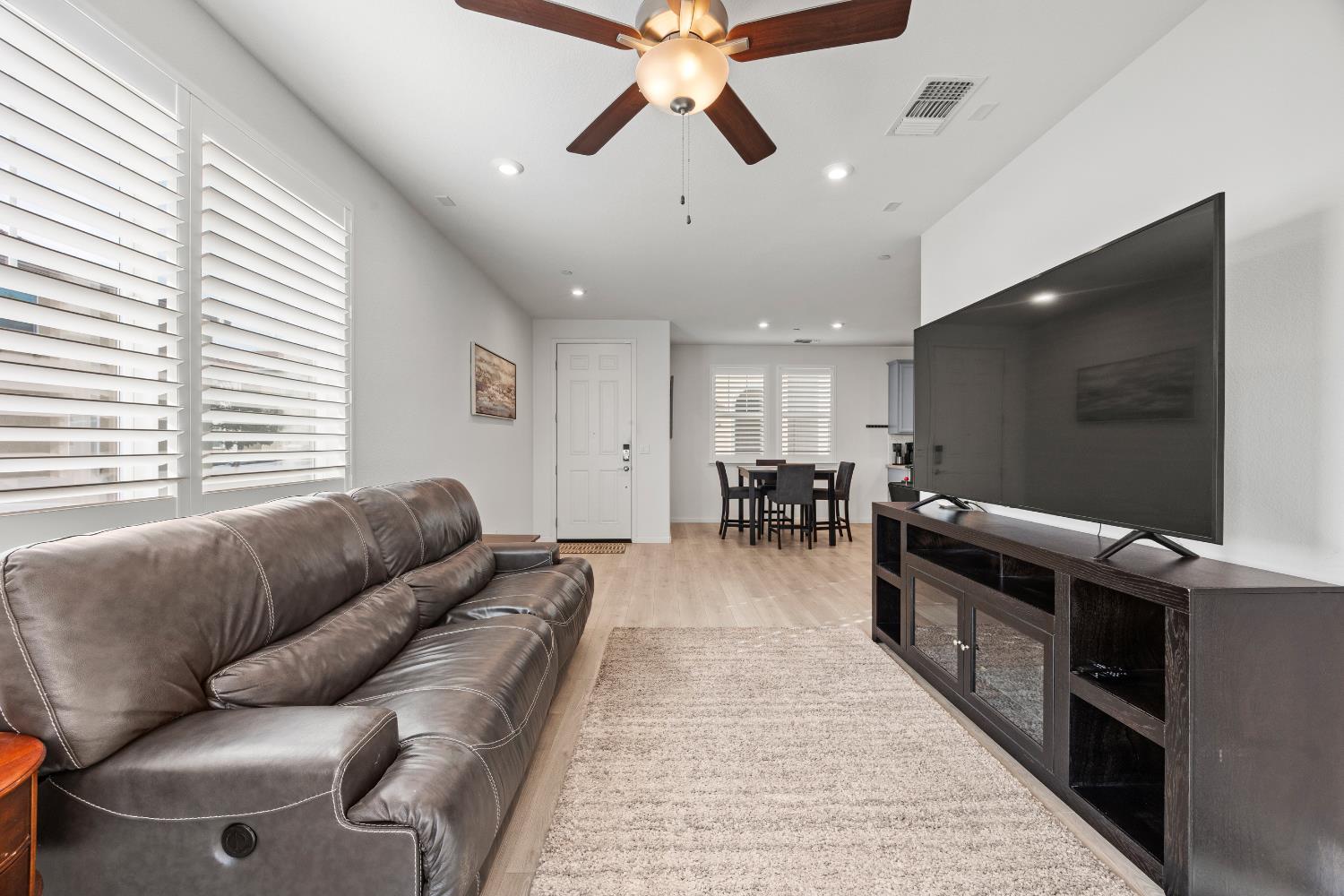 1048 Knox Way Roseville, CA 95747 - Photo 7 of 29 a living room with furniture and a flat screen tv