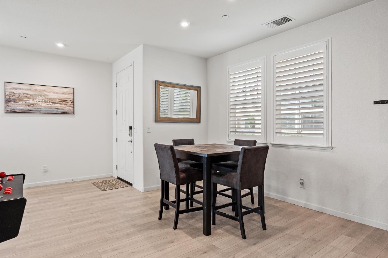 1048 Knox Way Roseville, CA 95747 - Photo 9 of 29 a view of a dining room with furniture and wooden floor