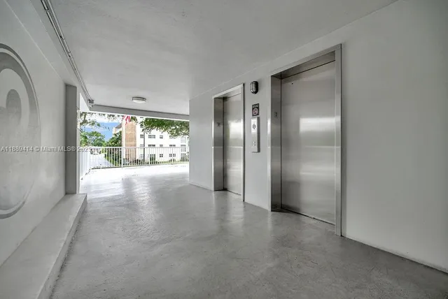 a view of a swimming pool with a lawn chairs