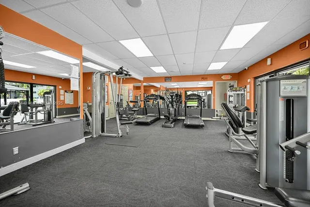 a room with gym equipment and a large window
