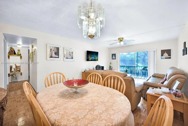 a bedroom with furniture and a large window