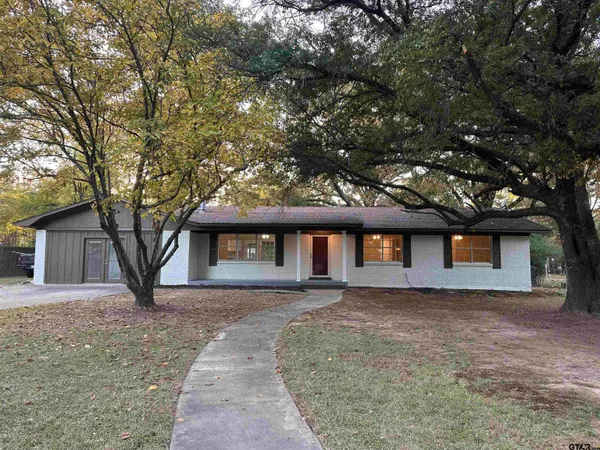 front view of house with a trees