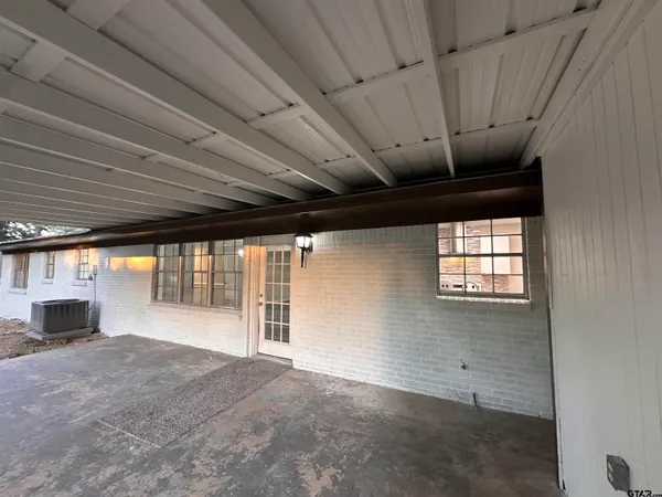 a view of storage and utility room with wooden floor