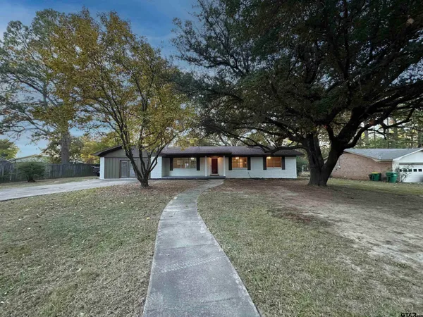 a house with trees in front of it