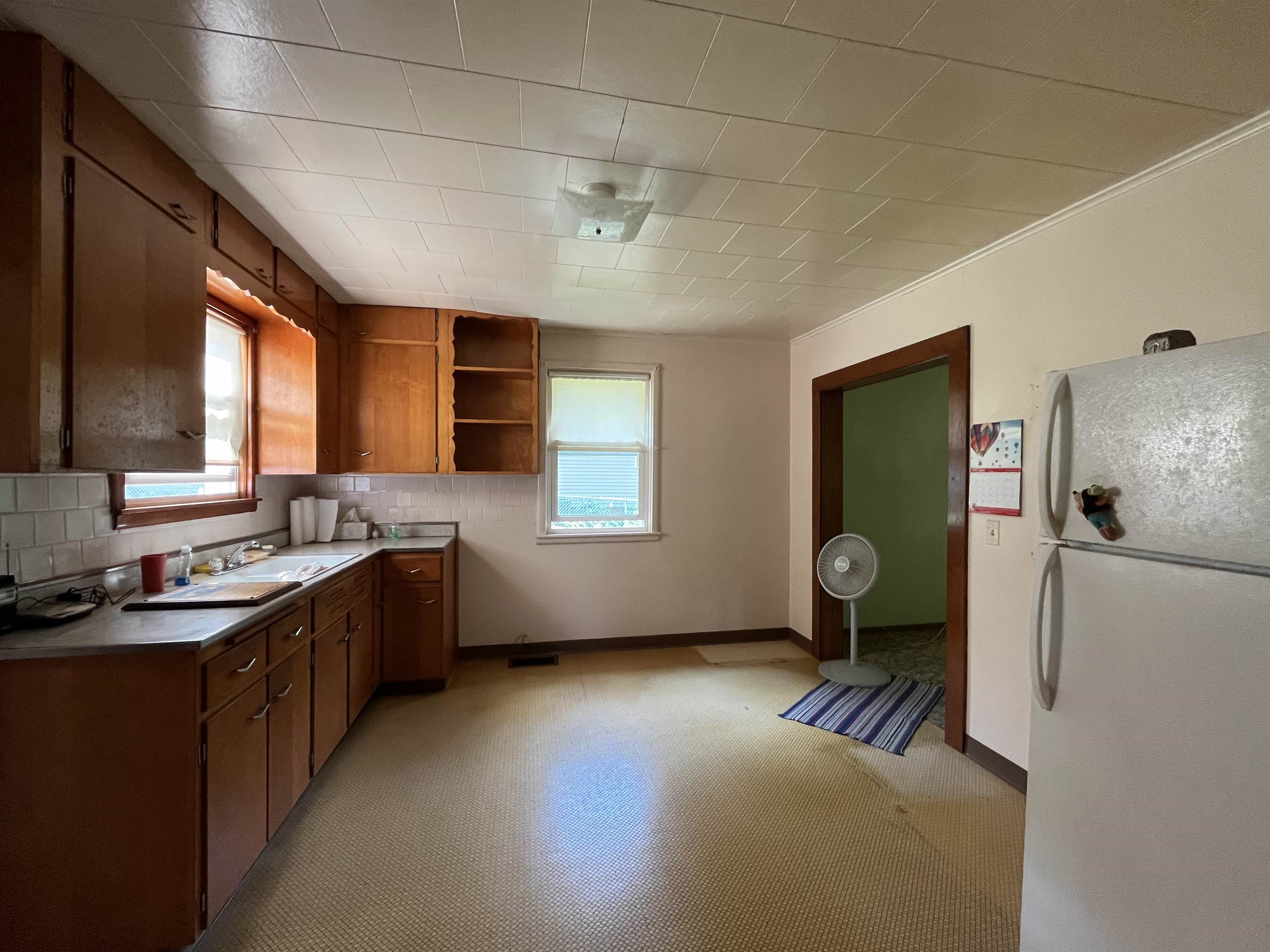 113 3rd Street Mark, IL 61326 - Photo 4 of 9 a kitchen with granite countertop a sink stove and cabinets