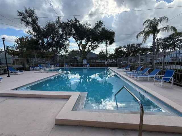 a view of swimming pool with a patio