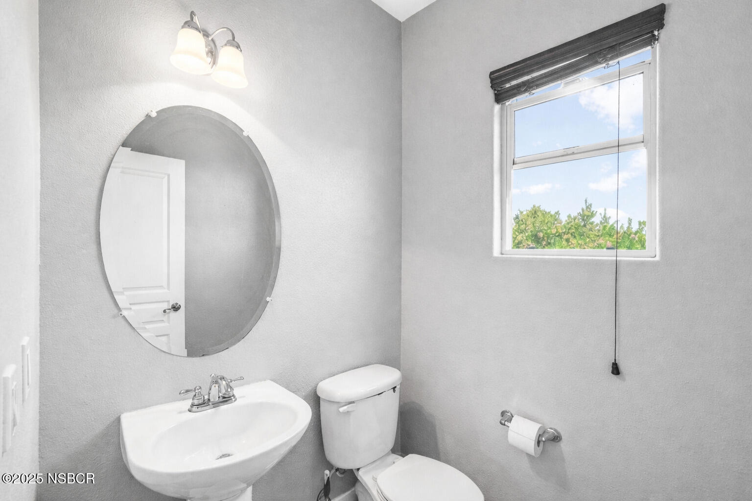 2742 Niverth Place Santa Maria, CA 93455 - Photo 11 of 23 a bathroom with a toilet sink vanity and mirror