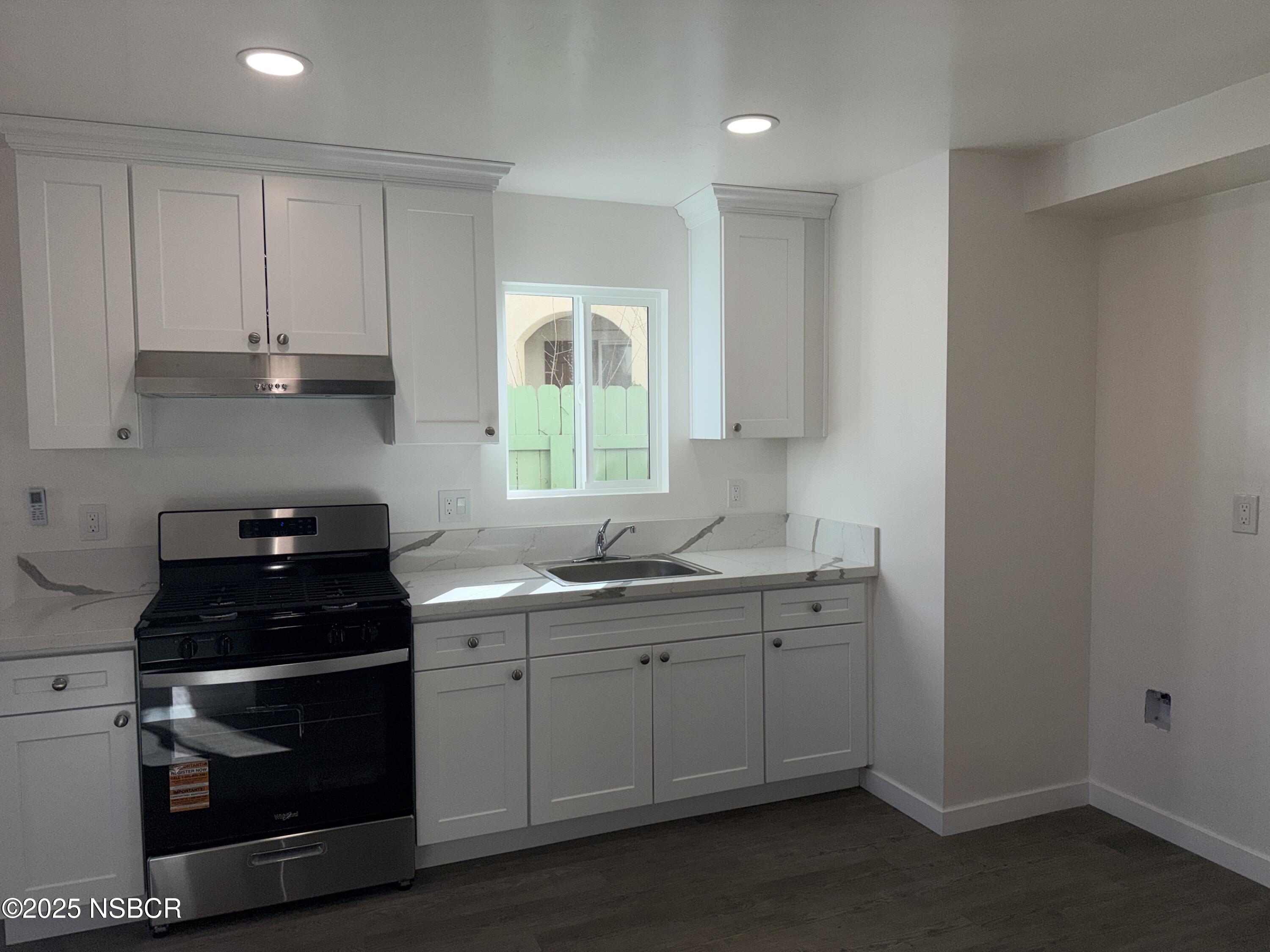 2742 Niverth Place Santa Maria, CA 93455 - Photo 14 of 23 a kitchen with a sink and cabinets