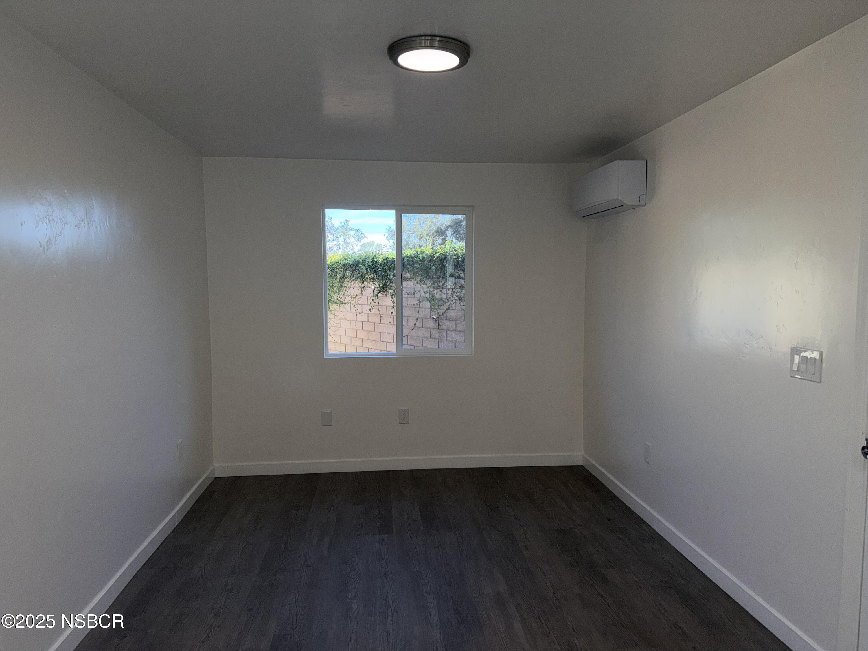2742 Niverth Place Santa Maria, CA 93455 - Photo 15 of 23 an empty room with wooden floor and windows