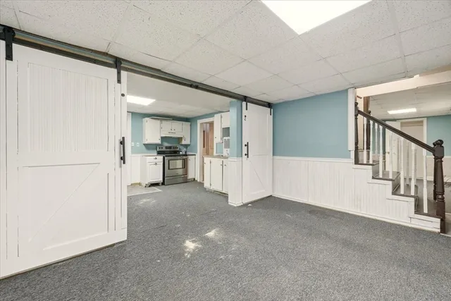 a view of a big room with closet and windows