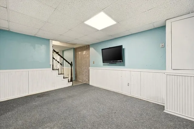 a view of an empty room with a flat screen tv