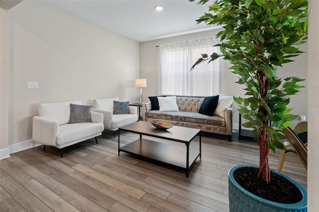15203 Willow Ridge Drive Montverde, FL 34756 - Photo 11 of 51 a living room with furniture and a potted plant