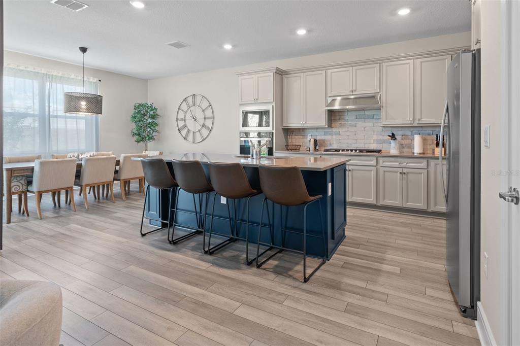 15203 Willow Ridge Drive Montverde, FL 34756 - Photo 21 of 51 a large kitchen with lots of counter space and furniture