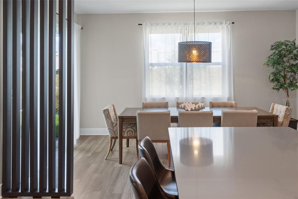 15203 Willow Ridge Drive Montverde, FL 34756 - Photo 23 of 51 a view of a dining room with furniture and window