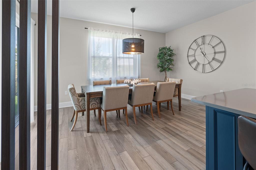 15203 Willow Ridge Drive Montverde, FL 34756 - Photo 24 of 51 a view of a dining room with furniture window and wooden floor
