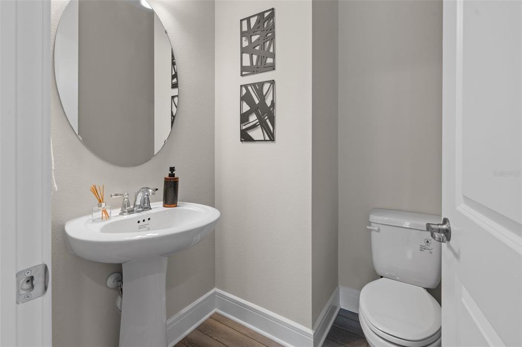 15203 Willow Ridge Drive Montverde, FL 34756 - Photo 29 of 51 a bathroom with a toilet sink and mirror