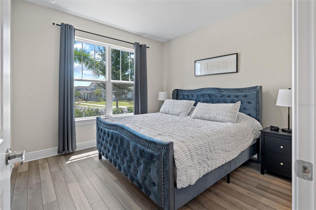 15203 Willow Ridge Drive Montverde, FL 34756 - Photo 4 of 51 a large bed sitting in a bedroom next to a window