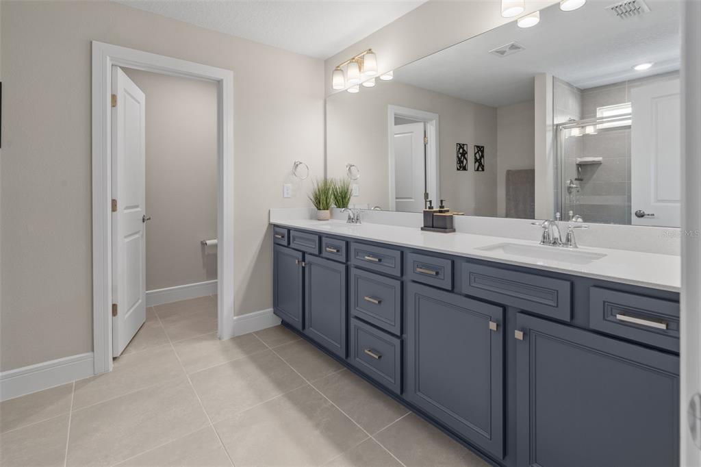 15203 Willow Ridge Drive Montverde, FL 34756 - Photo 45 of 51 a spacious bathroom with a double vanity sink mirror and double