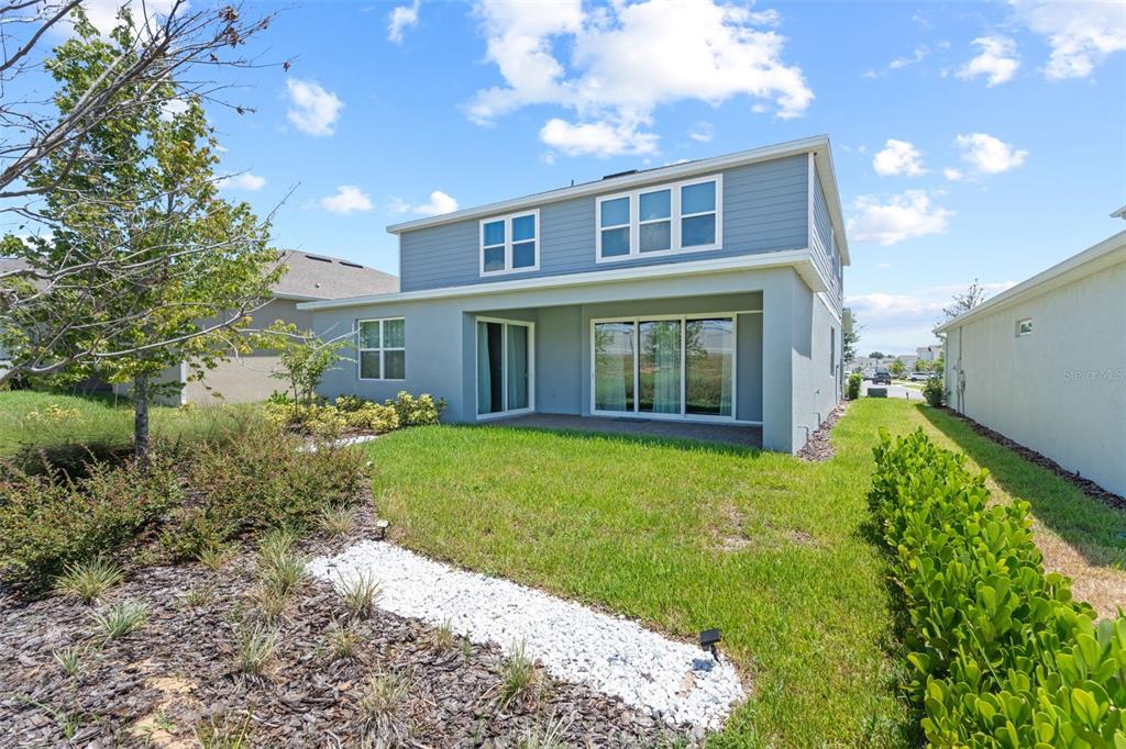 15203 Willow Ridge Drive Montverde, FL 34756 - Photo 50 of 51 a view of a house with backyard and garden