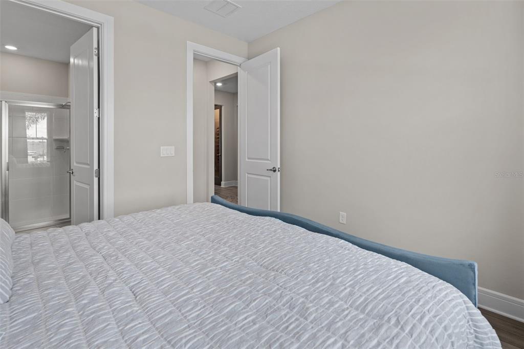 15203 Willow Ridge Drive Montverde, FL 34756 - Photo 5 of 51 a bedroom with a bed and a mirror