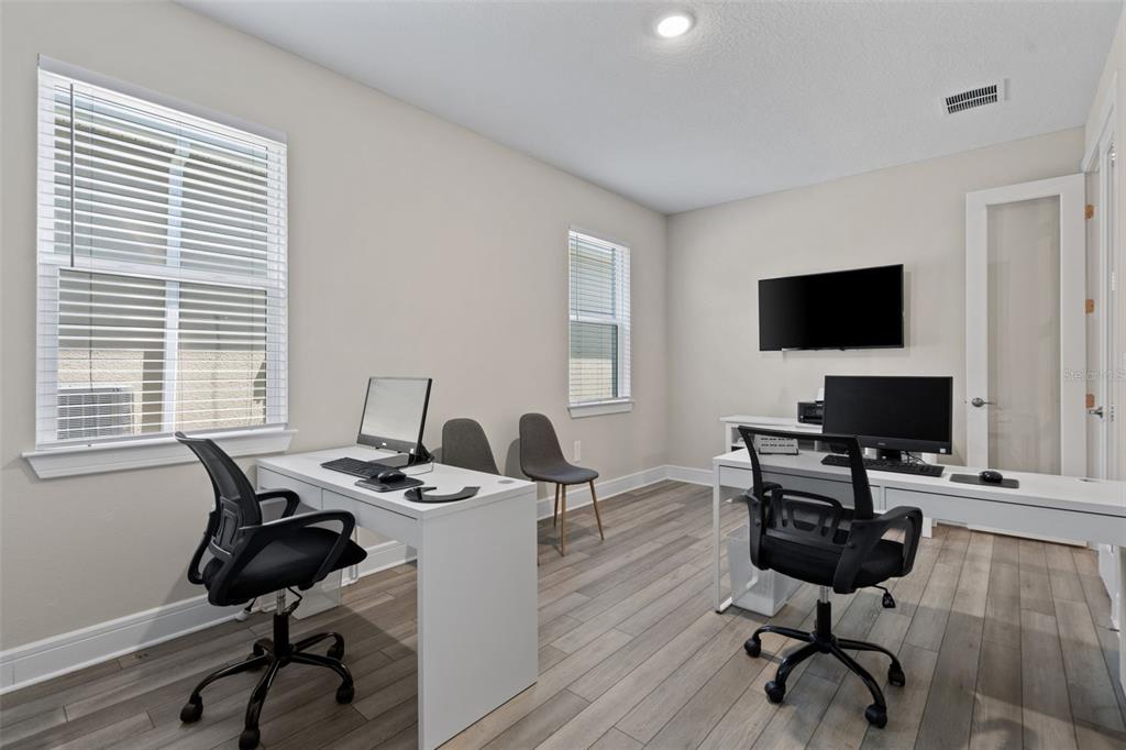 15203 Willow Ridge Drive Montverde, FL 34756 - Photo 8 of 51 a view of a workspace with a window and lounge chair