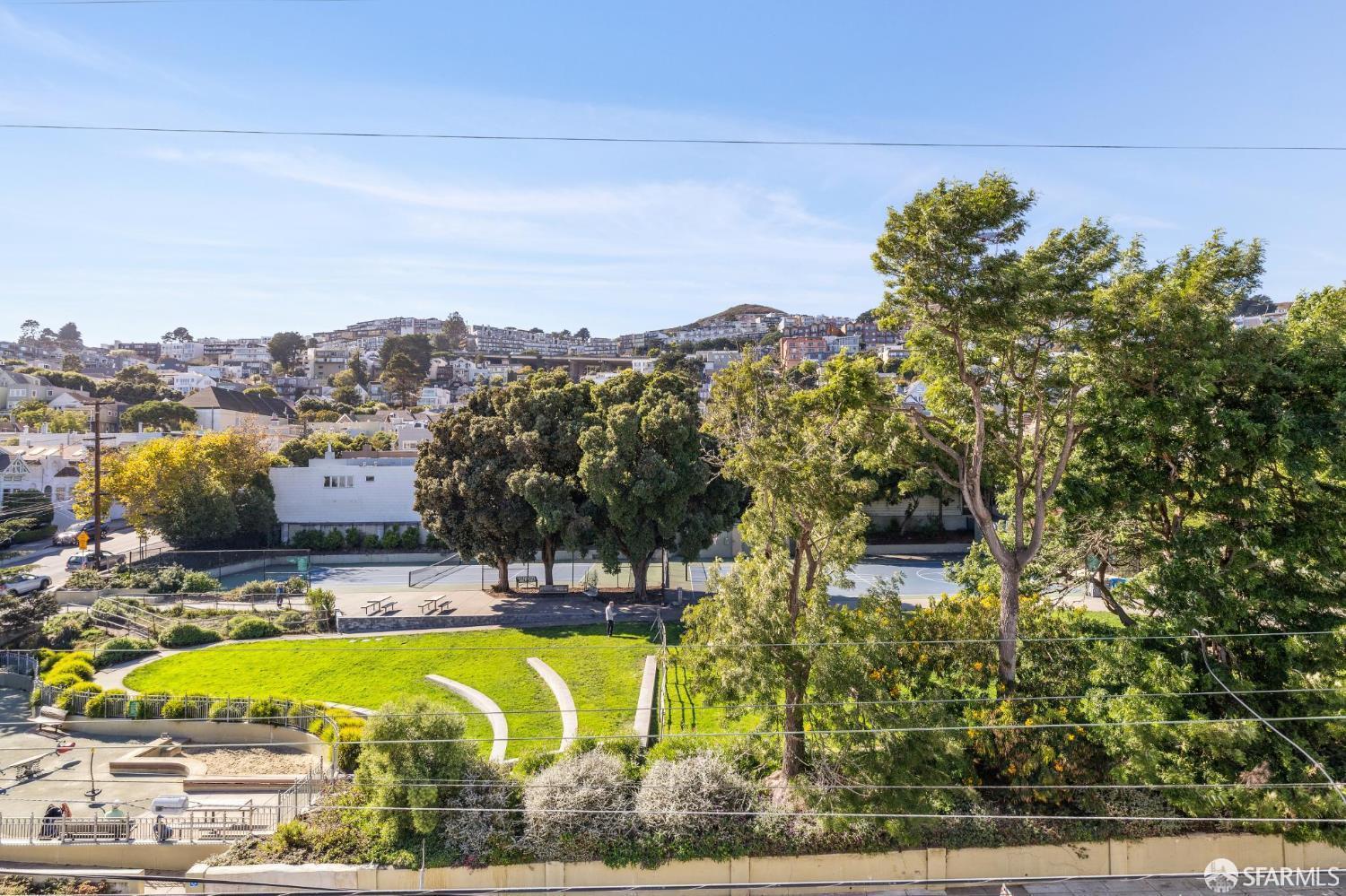 729 Douglass Street San Francisco, CA 94114 - Photo 41 of 92 a view of a swimming pool with a table and chairs
