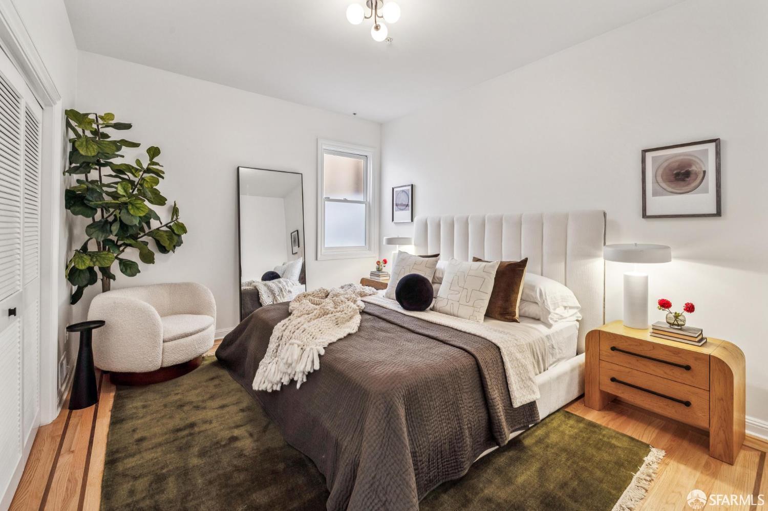 729 Douglass Street San Francisco, CA 94114 - Photo 58 of 92 a bedroom with bed and a potted plant