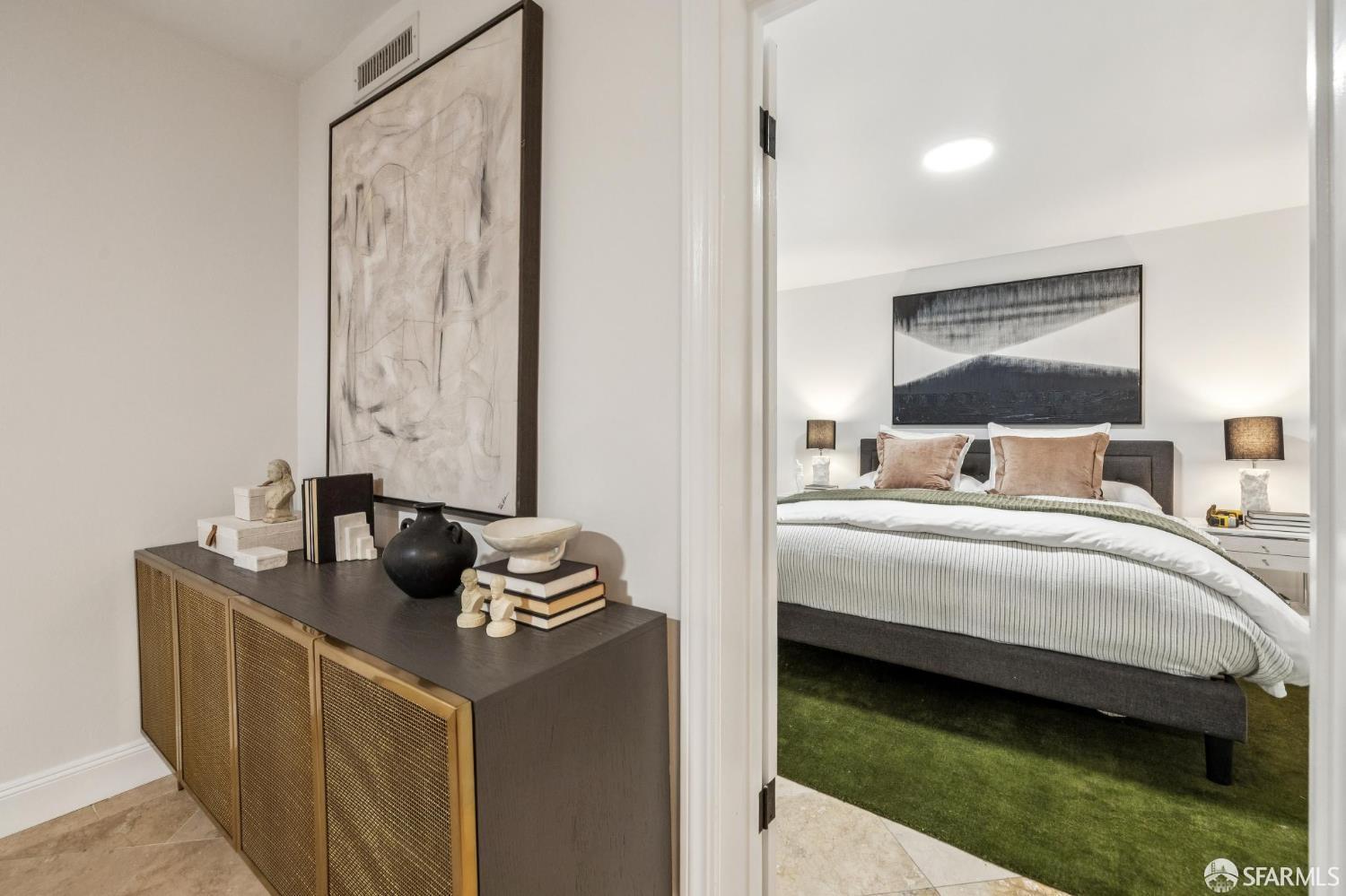 729 Douglass Street San Francisco, CA 94114 - Photo 81 of 92 a bedroom with a bed and a flat screen tv