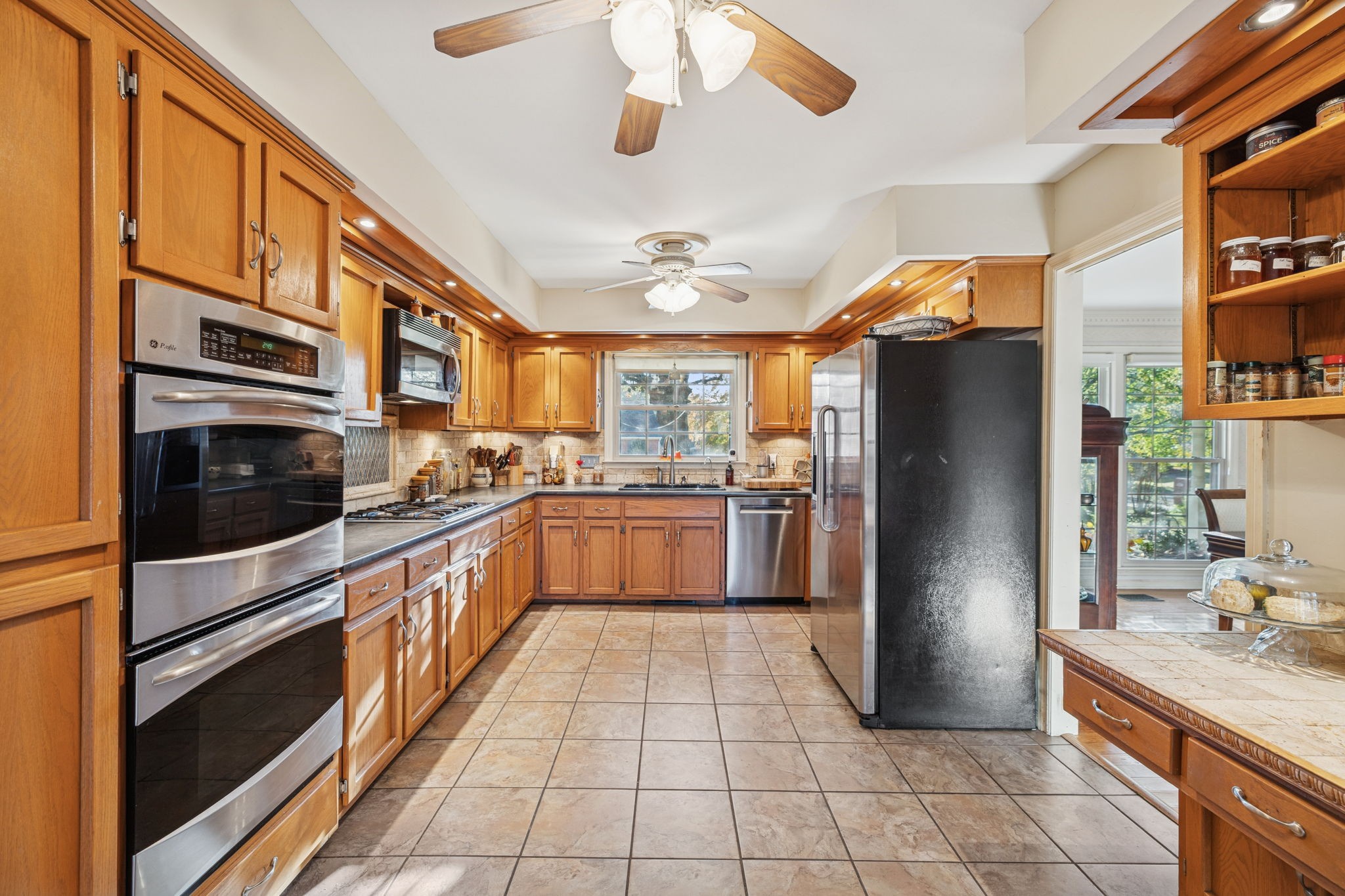 129 West Ridge Drive Hendersonville, TN 37075 - Photo 11 of 44 a kitchen with stainless steel appliances granite countertop a refrigerator a stove and a sink with cabinets