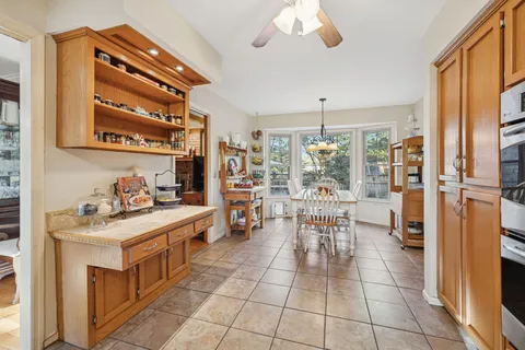 a kitchen with a stove and a refrigerator