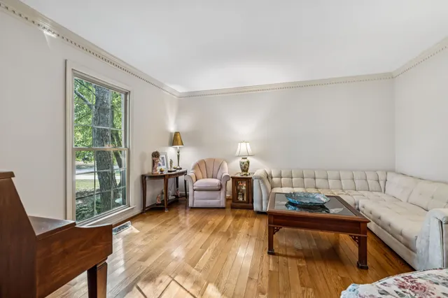 a bathroom with a sink vanity mirror and toilet