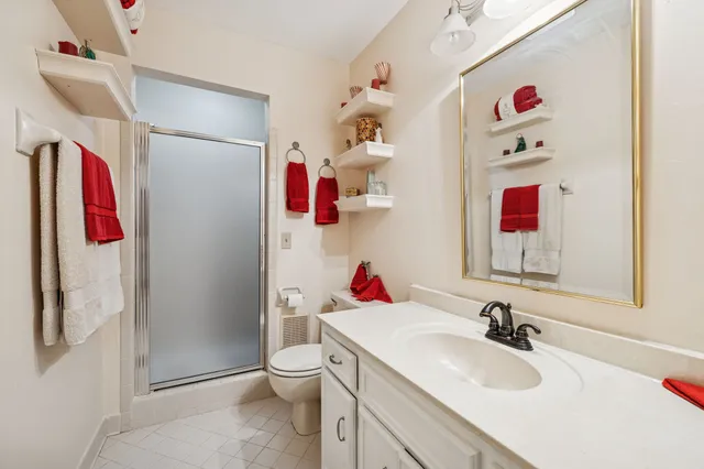 a view of a hallway view with wooden floor and staircase