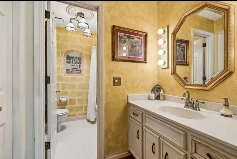 a bathroom with a toilet a sink and bathtub