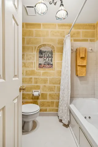 an aerial view of a residential houses with city view