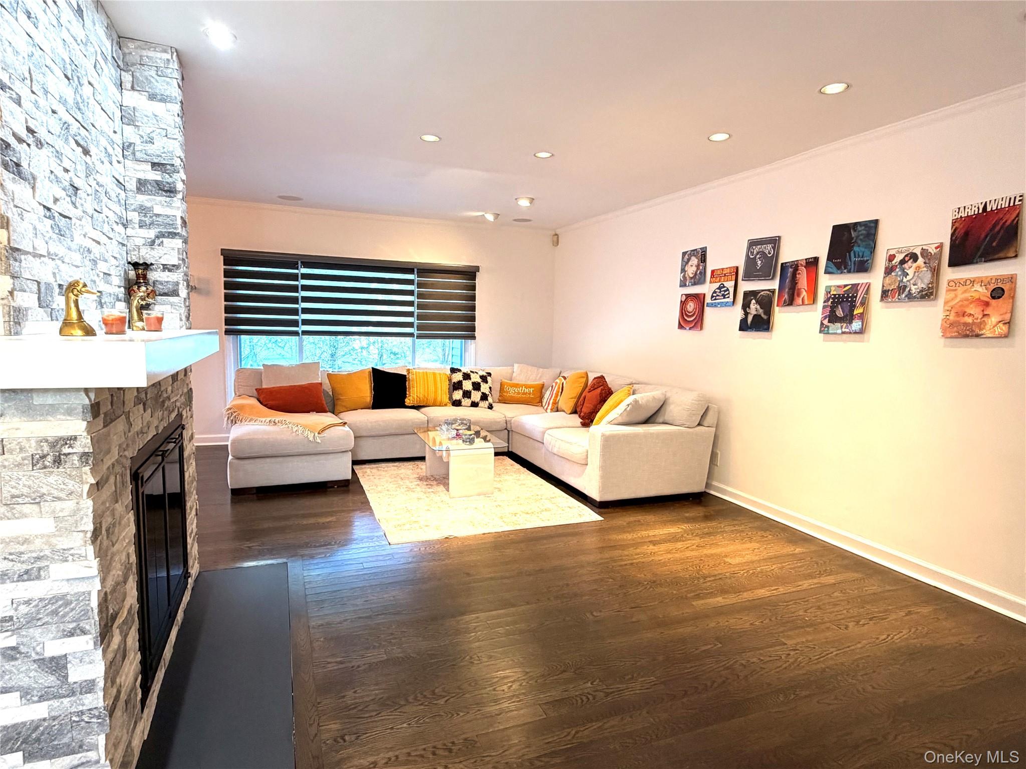 262 Channon Road Hewlett, NY 11557 - Photo 14 of 27 a living room with furniture and a fireplace