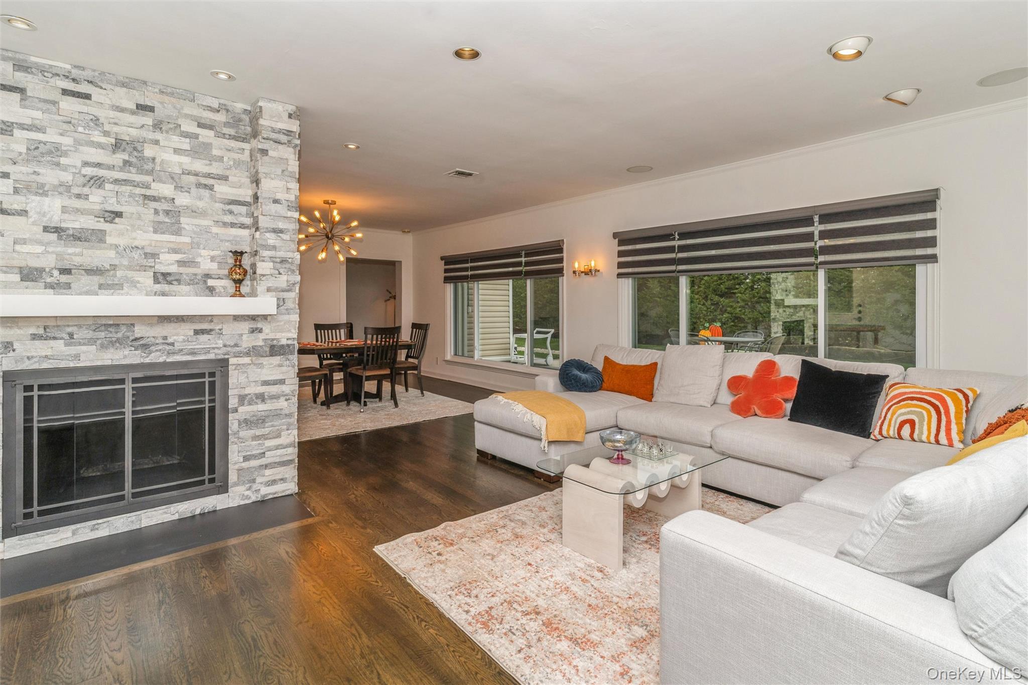 262 Channon Road Hewlett, NY 11557 - Photo 17 of 27 a living room with furniture and a fireplace