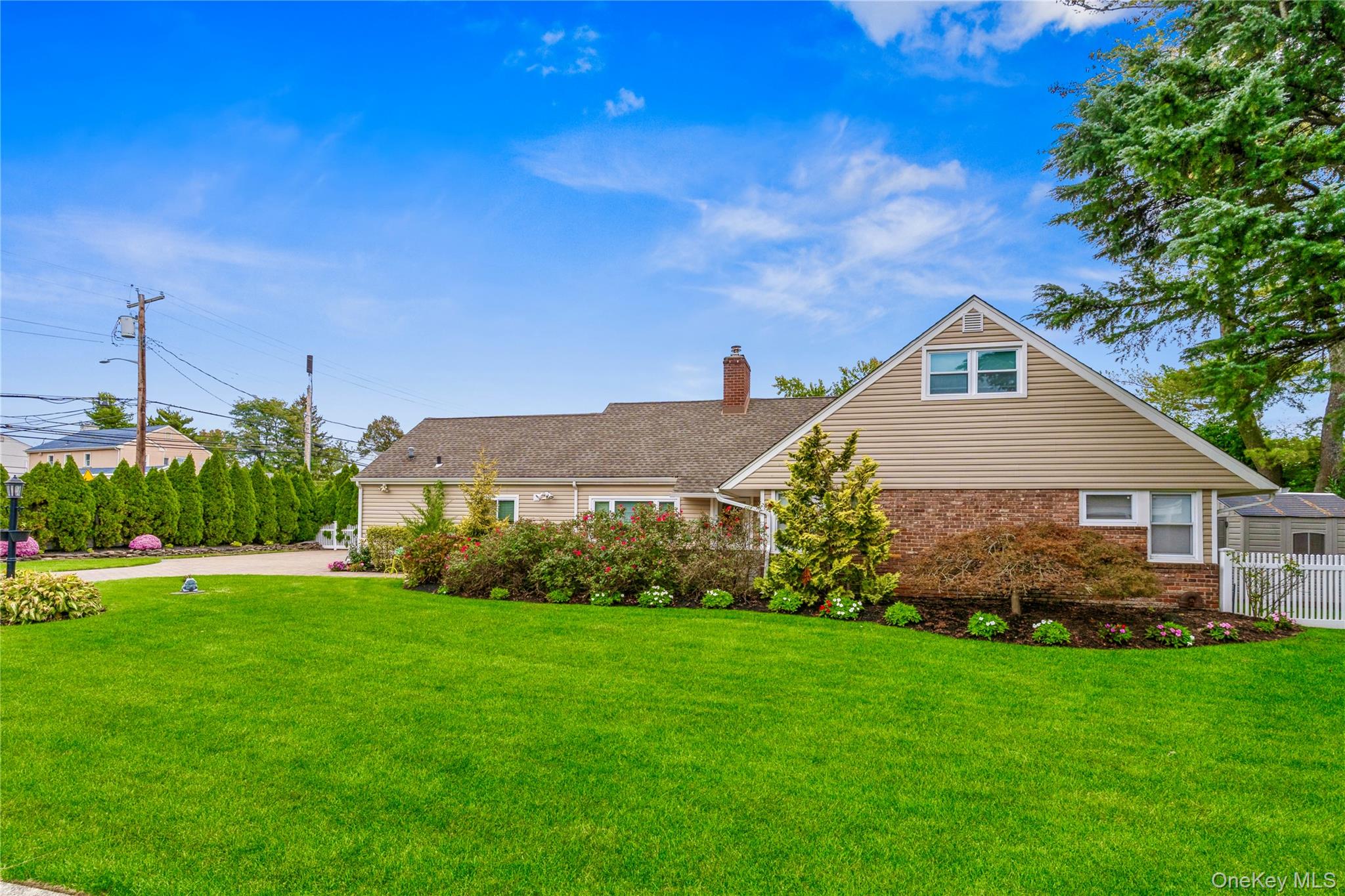 262 Channon Road Hewlett, NY 11557 - Photo 2 of 27 a view of a house with backyard and garden