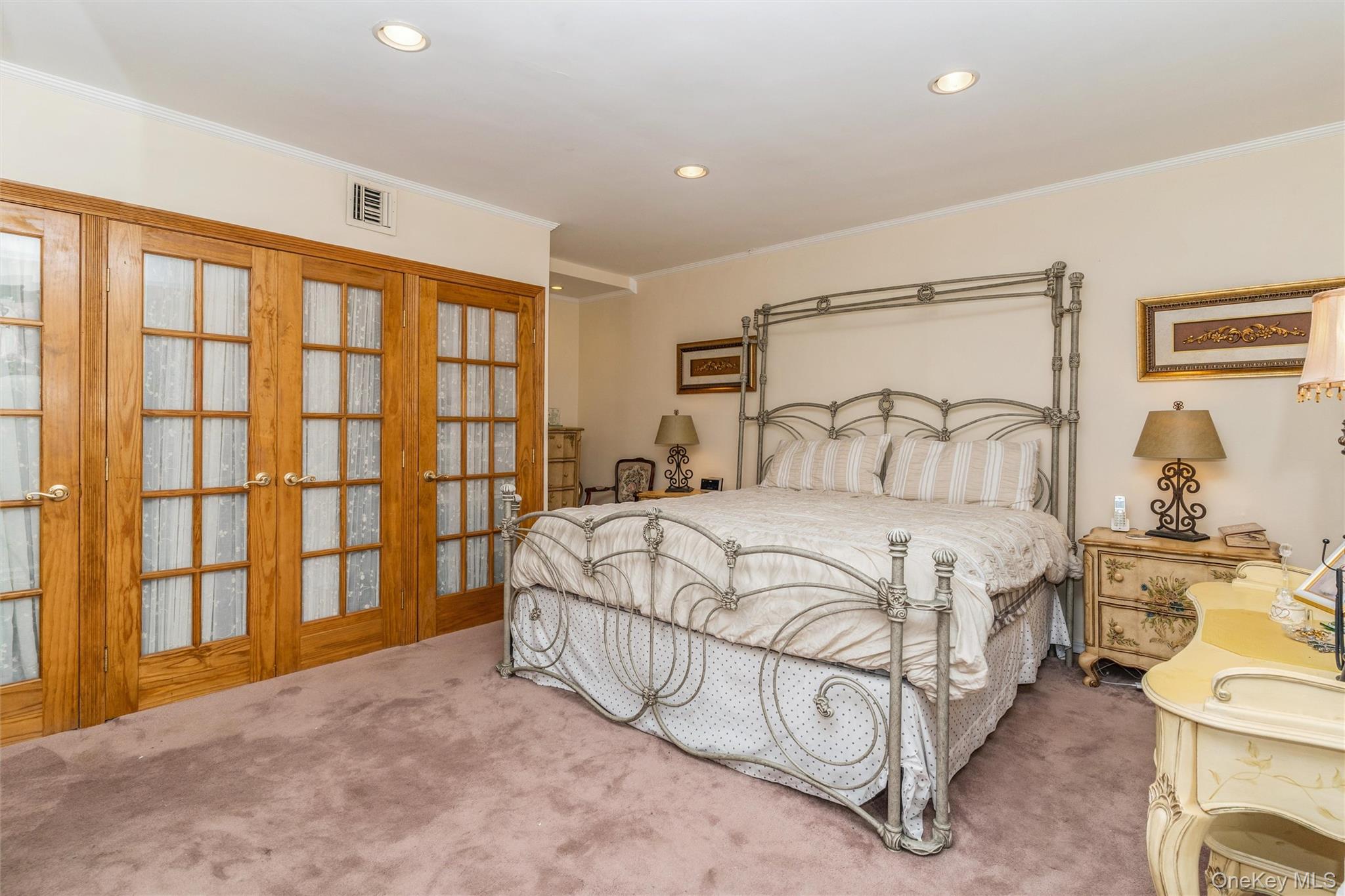 262 Channon Road Hewlett, NY 11557 - Photo 25 of 27 a bedroom with a large bed and a window