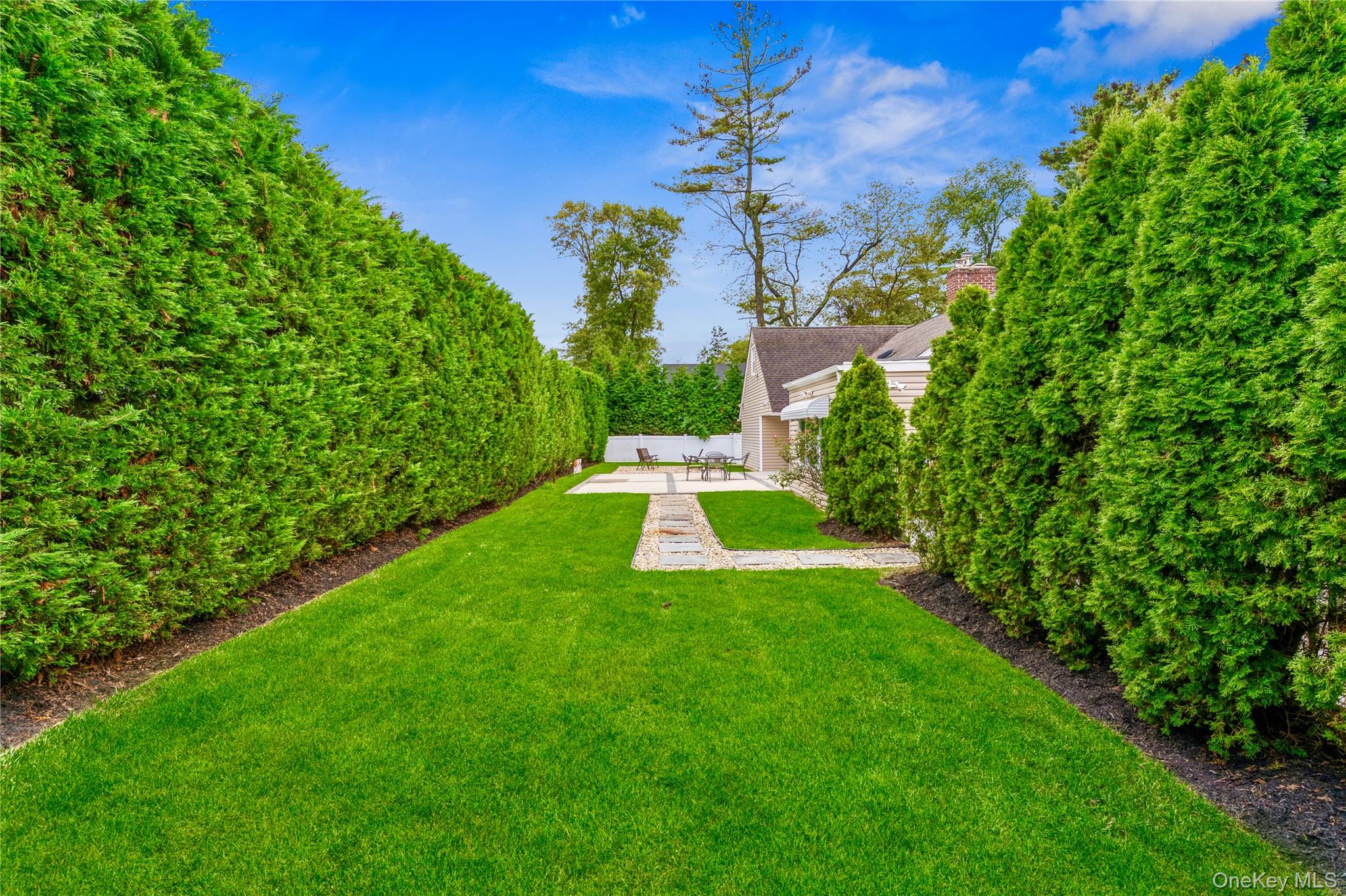 262 Channon Road Hewlett, NY 11557 - Photo 4 of 27 a view of a house with a big yard