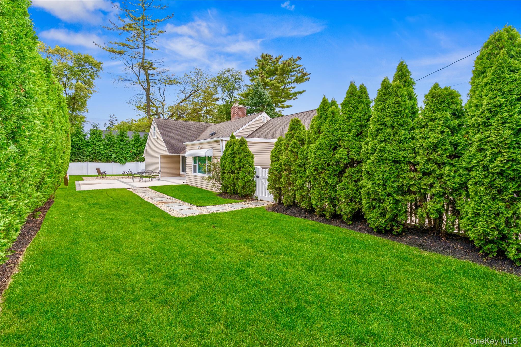 262 Channon Road Hewlett, NY 11557 - Photo 6 of 27 a view of a house with a yard