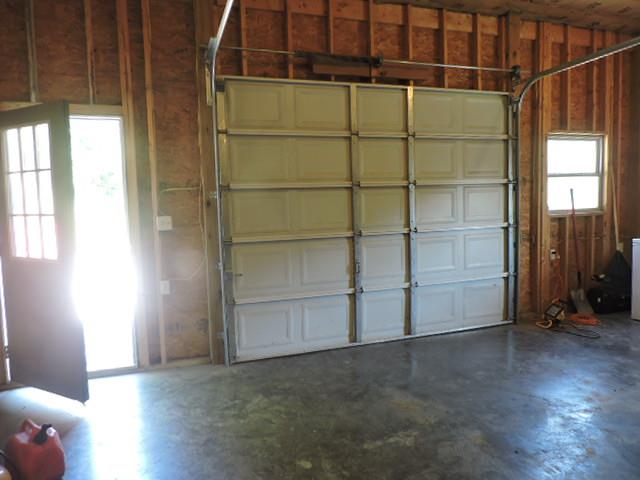 15 Friendship Hollow Road Pleasant Shade, TN 37145 - Photo 23 of 30 a view of an empty room with wooden floor and a window