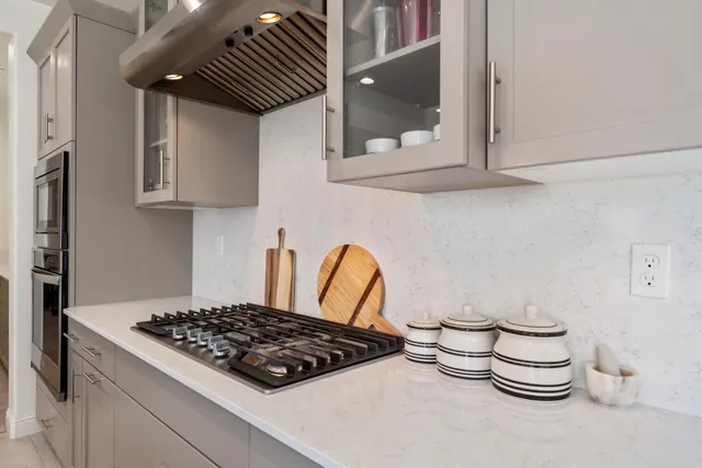 a kitchen with a stove and cabinets