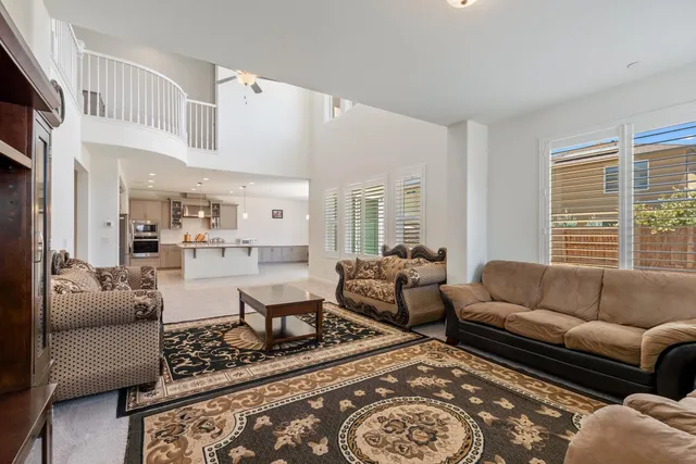 a living room with furniture or couch and a large window